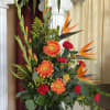 Bold and uplifting, this Ceremony Arrangement bursts with tropical beauty. Featuring birds