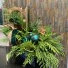 Our green and gold Holiday centerpiece is made of dry pine cones