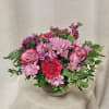 Unveil the essence of modern elegance with our captivating flower arrangement. Featuring