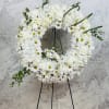 A Beautiful wreath of mixed white flowers. Can be made in different