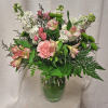 Our charming Everlasting Happiness flower arrangement in a delicate glass vase is