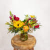 Inspired by winding country roads and golden hour light, the Backroads Bouquet