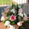 - 6 Light pink Roses
- 6 White Carnations
- 3 Stems Pink Lilies
-