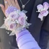 This combo feature lavender roses in a wrist corsage and a boutineer