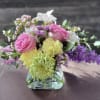 A  Cheerful mix of roses, carnations, mums, and wildflower accents in