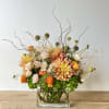 Beautiful one-sided arrangement with a mixture of roses, hydrangeas, dahlias, and more.