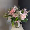 A beautifully selected bunch of the freshest flowers in a vase uniquely