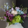 A beautifully selected bunch of the freshest flowers in a vase uniquely