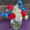 Cute little arrangement with bright colored flowers. Nice and compact for a