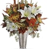 This beautiful bouquet of warm autumnal blooms and crisp white lilies, arranged