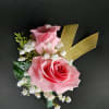 A classic spray rose boutonniere that compliments any suit. Perfect for prom