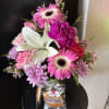 colorful mix flowers in vase with pancake snack 