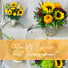 An assortment of fall flowers arranged in a vase or container. Every