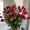 A timeless expression of love and passion, this arrangement features premium red