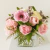 Delicate, charming, and effortlessly elegant- this arrangement of fresh pink blooms is