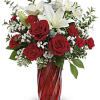 This Valentine&#039;s arrangement features red roses, white asiatic lilies, white alstroemeria, red