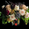 Steadfast arrangement consists in a mix of boho toned blooms on a