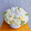 Beautiful white hydrangea arrangement. It&#039;s created with premium white roses, seasonal foliage