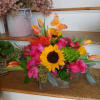 Roses, tulips, sunflowers, gerbera daisies and alstromeria designed in a wooden box
