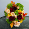 Traditional floral arrangement to celebrate Thanksgiving, is modernized in our shop and