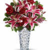 A stunning beauty! Long-stem red roses and pink stargazer lilies are arranged