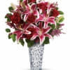 A stunning beauty! Long-stem red roses and pink stargazer lilies are arranged