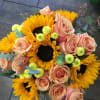 Hand tide bouquet May consist of peach roses sunflowers, yellow pompom, foliage