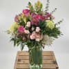 Introducing &quot;Blush Life,&quot; a delightful flower arrangement that combines vibrant shades of