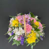 A basket of bright, colorful flowers to pick up anyone&#039;s spirits. Includes