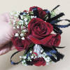 A classic red rose Corsage that compliments any suit. Perfect for prom