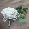 A classic white boutonni&egrave;re that compliments any suit. A perfect addition for