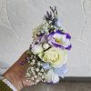 A classic white corsage with some ribbons, this wrist arrangement looks good