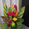Red roses, yellow rose, red ginger, bird of paradise,Monstera, variegated leaves, croton