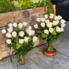 This set includes two matching vases, perfect for displaying together. Call 281-564-2600