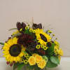a galvanized short cylinder filled with a modern take on autumn