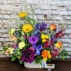 Express your heartfelt condolences with our Colorful Sympathy Blooms arrangement. This exquisite