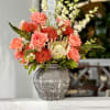 Featuring a show-stopping king protea at the center, fiery red pincushion proteas