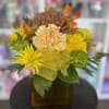 fresh flowers in orange vase 
