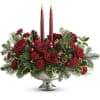 Deck the halls with this elegant centerpiece of rich red roses and
