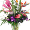 Escape to the tropics with this vibrant array of tropical flowers. This