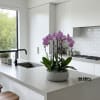A high quality Four pink orchids arrangement with a vase 12.5&quot; D