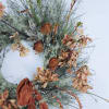 This long lasting wreath brings in the season with natural dried elements.