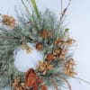 This long lasting wreath brings in the season with natural dried elements.