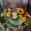 Birch container filled with festive thanksgiving flowers. **Flowers may vary