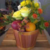 A basket with fresh fruits and flowers
