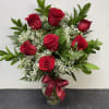  A timeless gesture of love, this stunning bouquet showcases a dozen