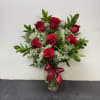  A timeless gesture of love, this stunning bouquet showcases a dozen