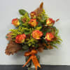 Celebrate the warmth of the season with this radiant autumn arrangement. Vibrant