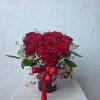 Heart shaped carnations in a red vase with hearts with a beatiful
