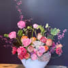  Experience the allure of our Floating Elegance Arrangement, where a sleek